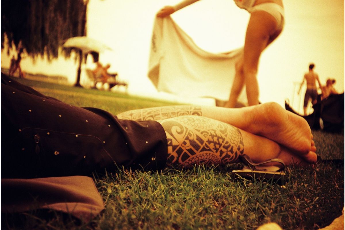 lomography redscale example image of a man on the grass