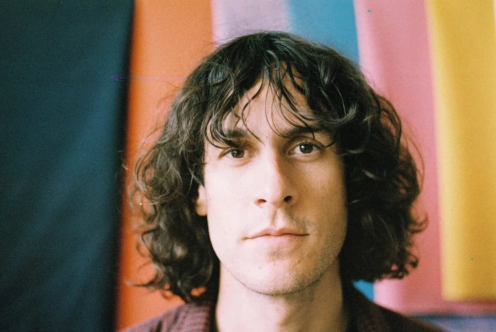 Sample photo of a man with long curly hair by wolfen nc500 35mm film