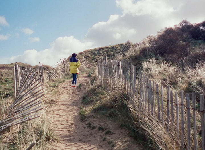 girl in the sand dunes shot with cinestill 800t film 